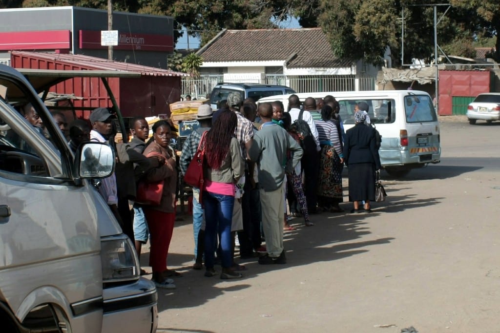 People queuing to use the chapas in Maputo