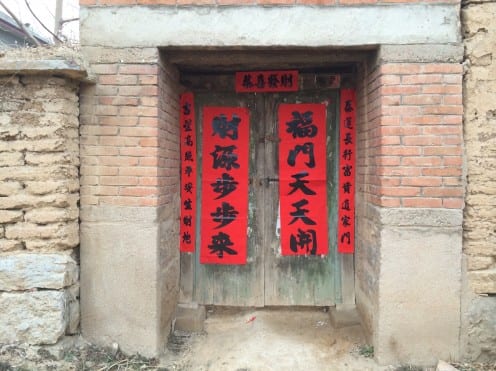 Poetic couplets hung on the door of a village house in preparation for Chinese NewYear (Photo: Tom McDonald)