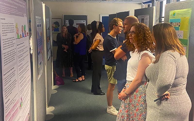People walking around and looking at research posters during the conference. Image permission: Miriam McBreen.