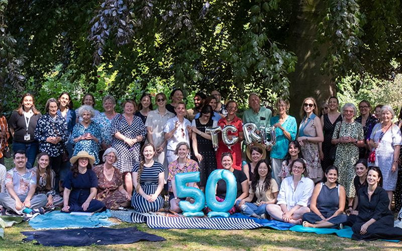 Group photo at a garden party celebrating TCRU's 50th anniversary. Credit: Mary Hinkley for UCL.