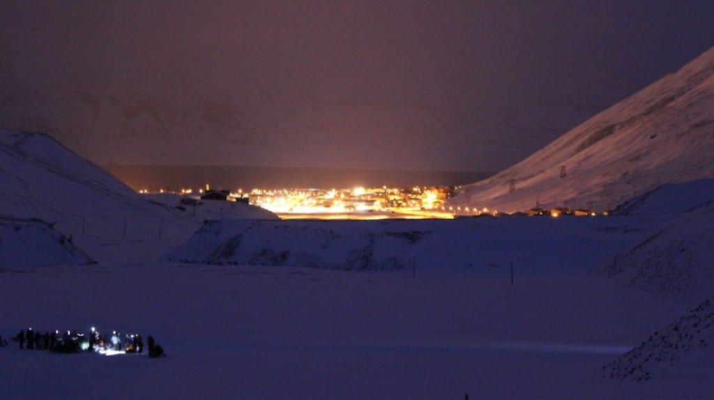 Field training in the afternoon with Longyearbyen town in the background