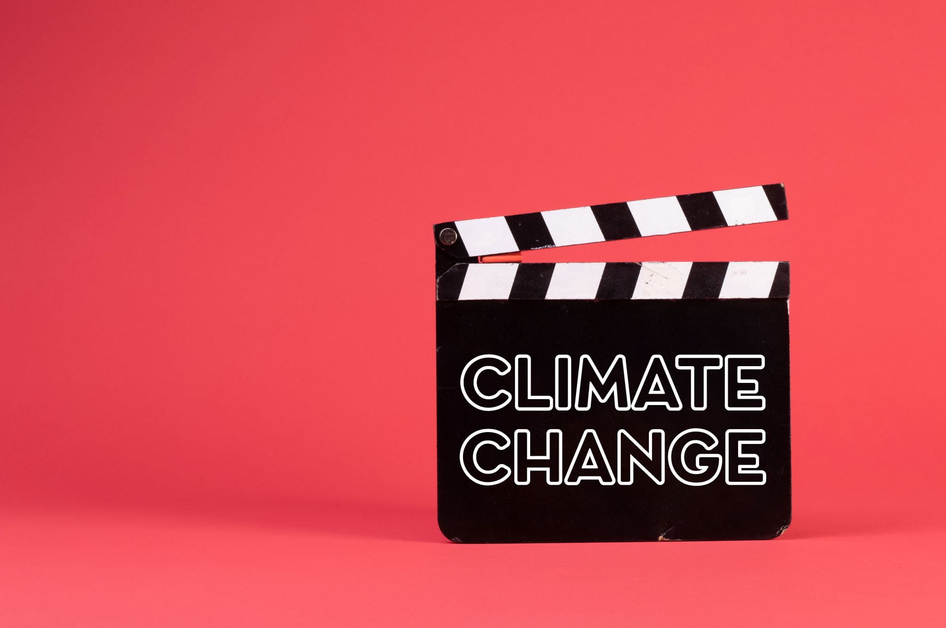 Image of a clapper board with climate change written on it in capitals letters.