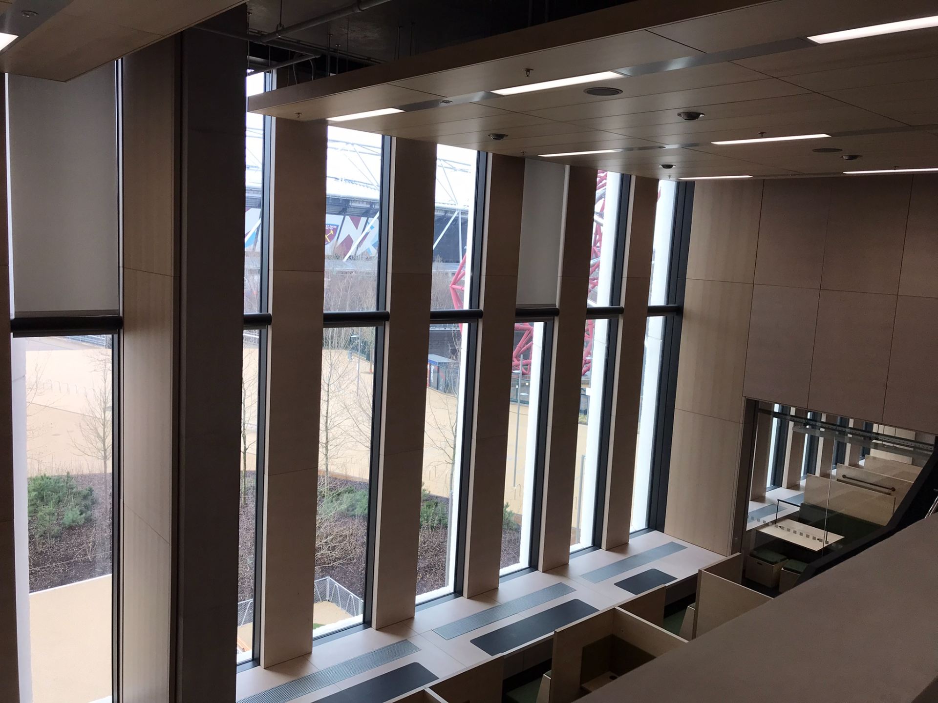 View of learning spaces in the library, looking down from the mezzanine
