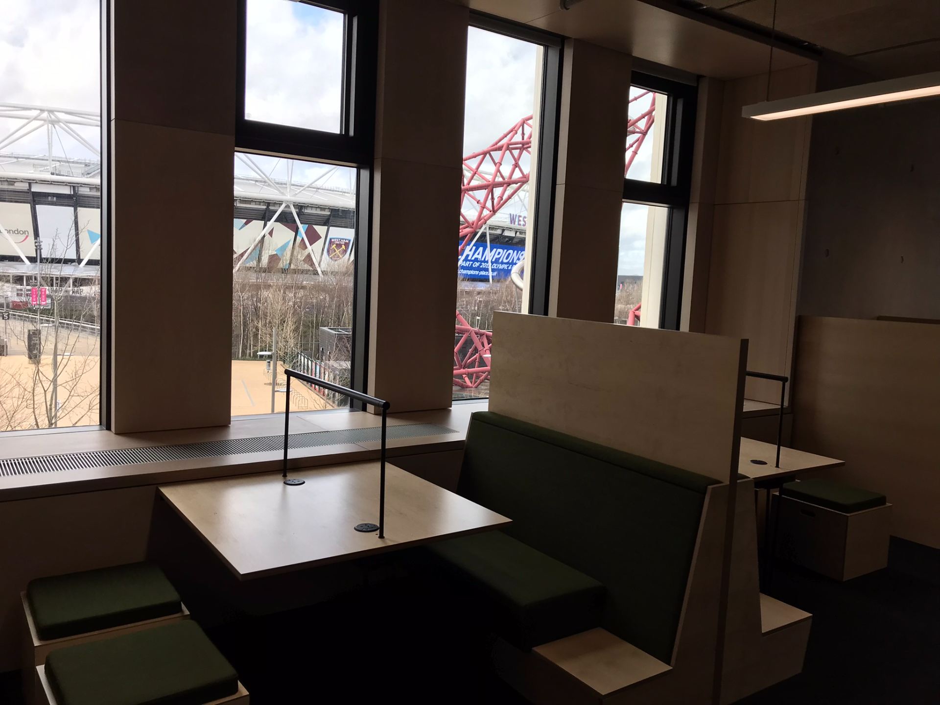 View of study desks with London Stadium and the Orbit in the background through the windows