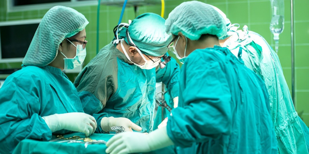 medical staff undertaking operation