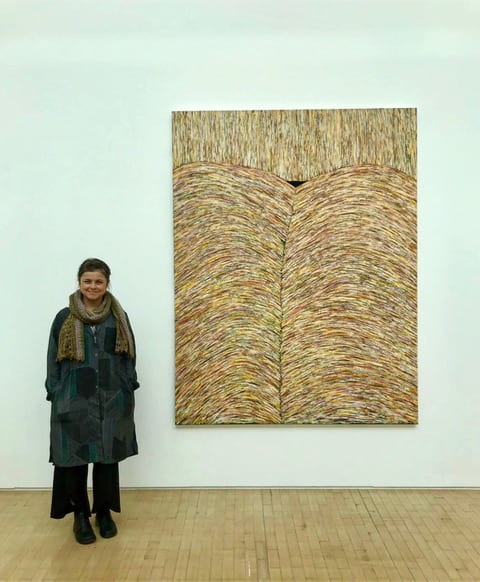 Gabriela Giroletti standing in front of painting at Bloomberg New Contemporaries 2019