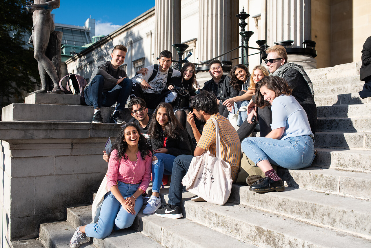 students laughing on the Portico steps at UCL