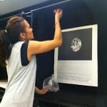 Susie, our exhibitions Officer, installing NASA prints. 