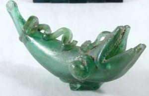 A green glass dolphin