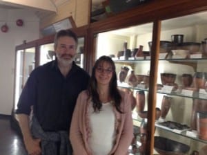 Guy Funnell and Amanda Hawkins in the Petrie pottery gallery beside Predynatic black-topped pottery.