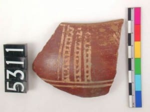 Pottery piece: Rim sherd with red polished surface and white painted decoration (Petrie’s "Cross-Lined ware" C-Ware)