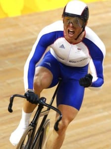 Sir Chris Hoy cycling in Team GB kit in a velodrome