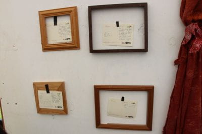 Display of postcards with memories on them, written by visitors