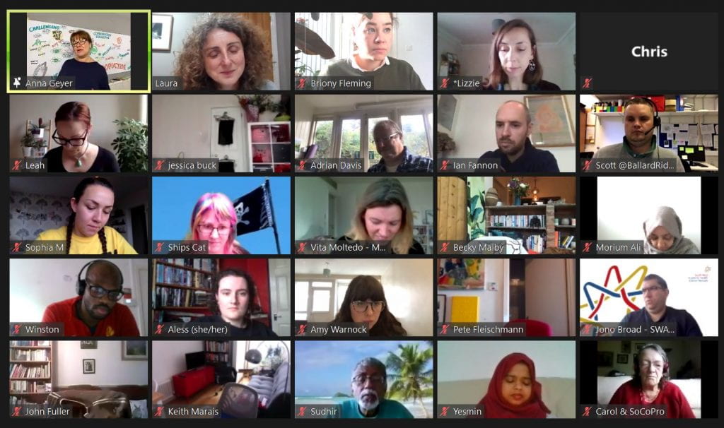 Zoom call screenshot with lots of faces listening to a talk