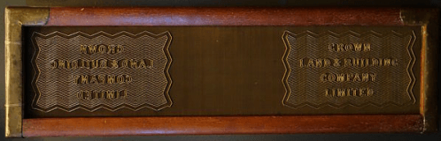 A wove mould, featuring two large watermark designs. Between the watermarks the smooth surface of the woven screening is visible, which leaves the paper with a fabric-like textured appearance, without the prominent horizontal and vertical lines of laid paper. (Image credit: Wove mould made by J. Brewer, London, England - Robert C. Williams Paper Museum, CC0 1.0)