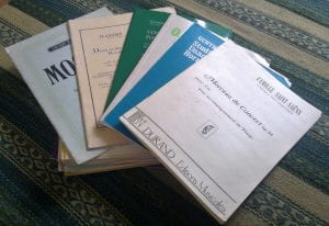a collection of printed music for the French horn