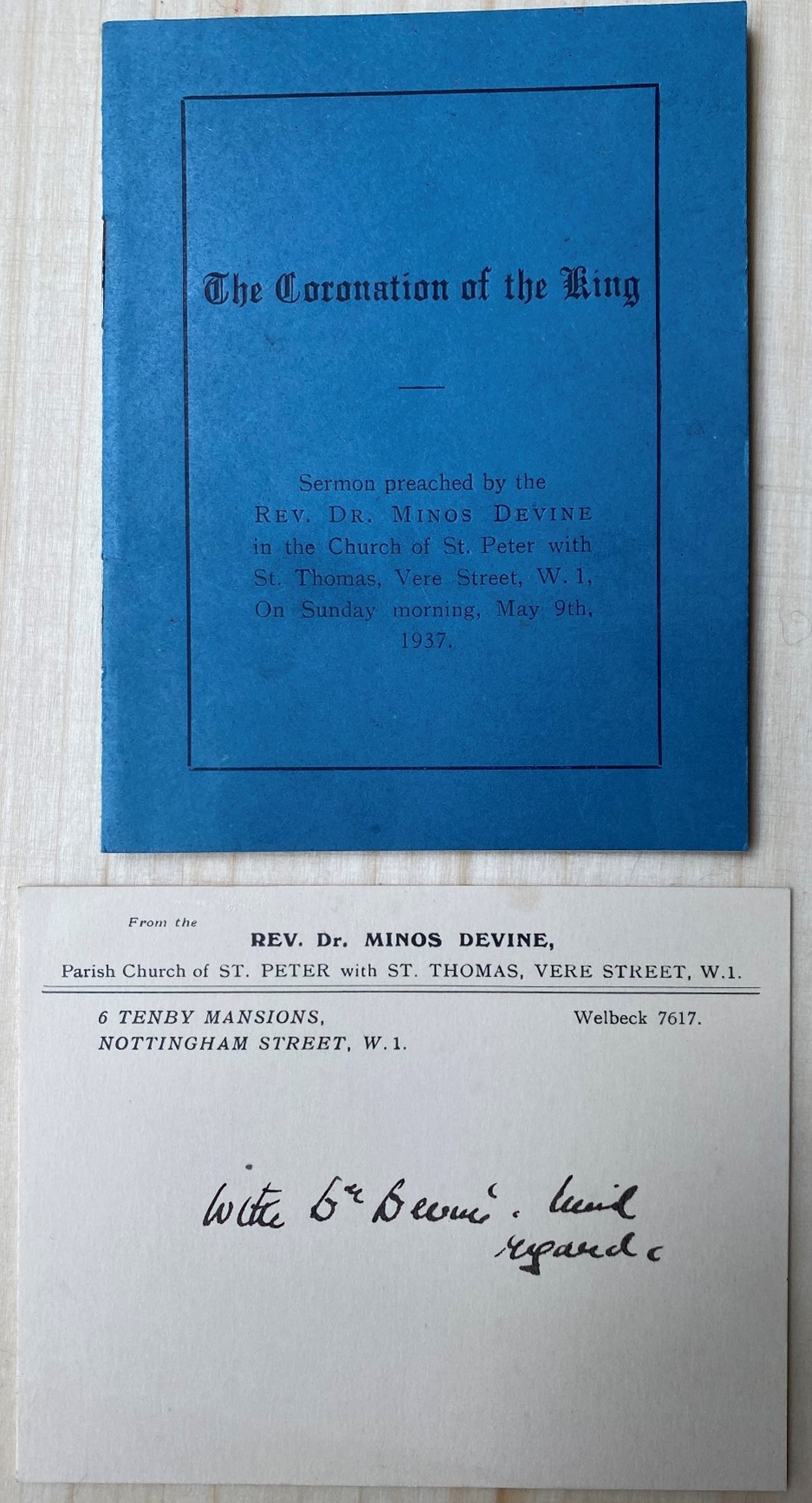 A blue pamphlet with the title 'The Coronation of the King: Sermon preached by the REV. DR. Mions Devine in the Church of St. Peter with St. Thomas, Vere Street, W.1., on Sunday Morning May 9th, 1937.' Underneath the pamphlet is a card from Minos Devine, however his handwriting is very hard to read. 