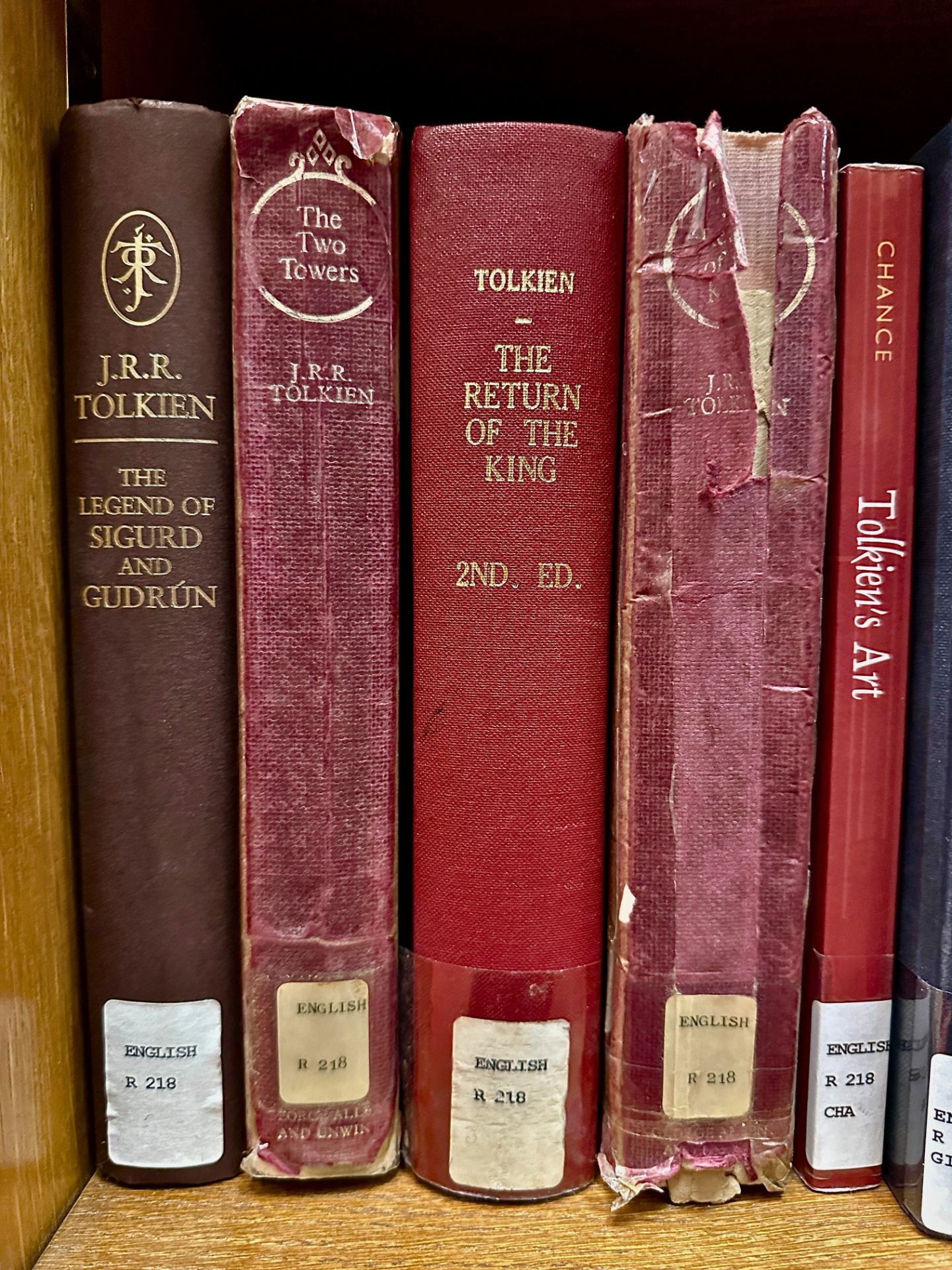 An image of JRR Tolkien's books on a shelf in the main library. 