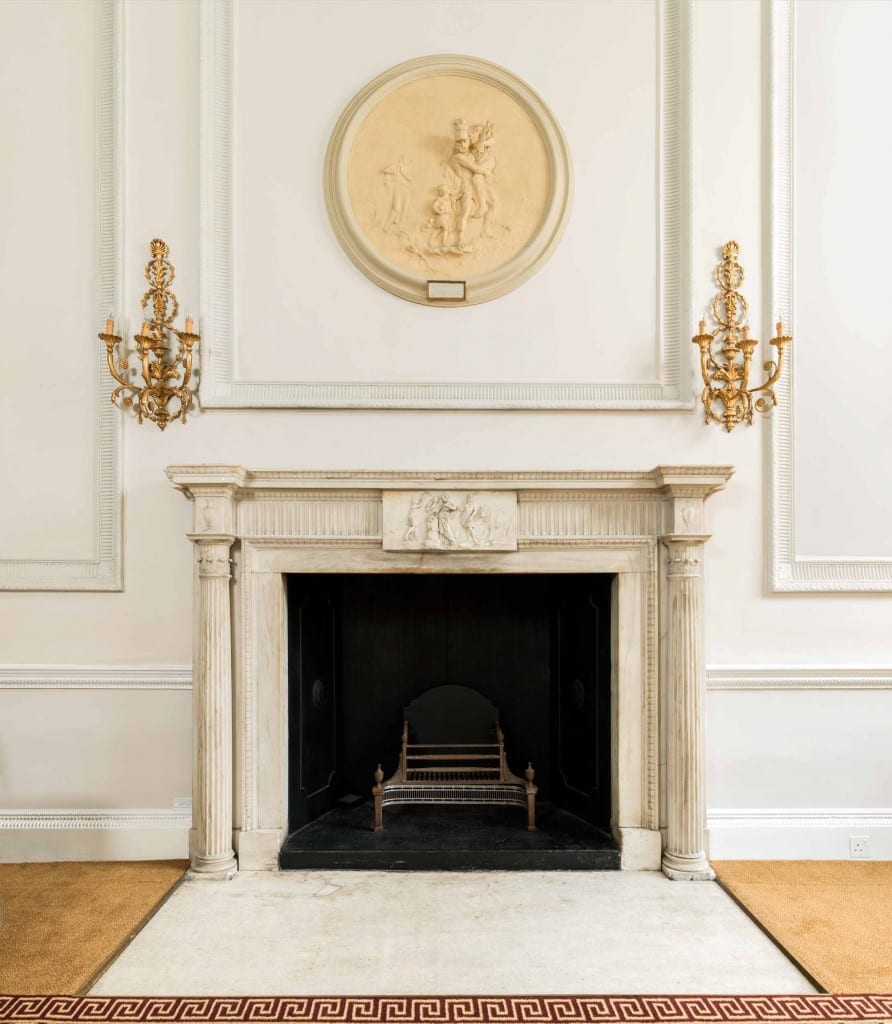 The fireplace in the front room of the ground floor at Chandos House (© Historic England, Chris Redgrave)