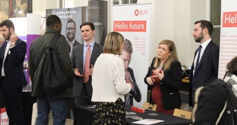 Students talking to employers at a UCL Careers fair