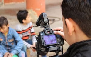 One of the children supported by the Refugee Film Project films his friends